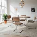 Set of 4 vintage sled chairs from the 1970s