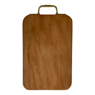 Solid wood cutting board with brass handle