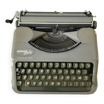 Machine à écrire grise hermes baby fabriquée en suisse