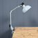 Light grey Rademacher clamp lamp with large enamel shade