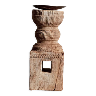 Candle holder in light carved wood