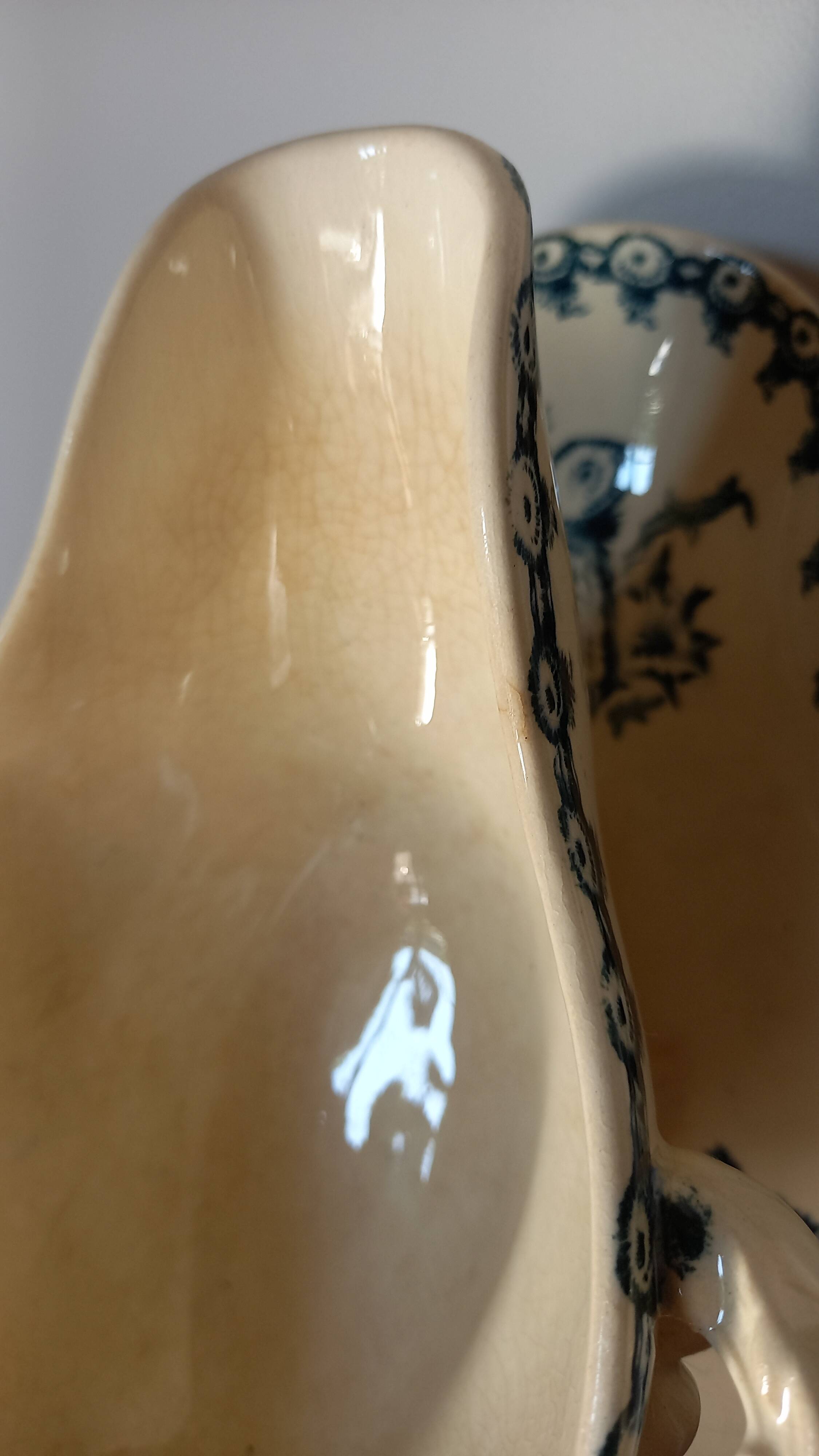 Old gravy boat on frame in terre de fer earthenware by gien, “chardons” model in blue-green