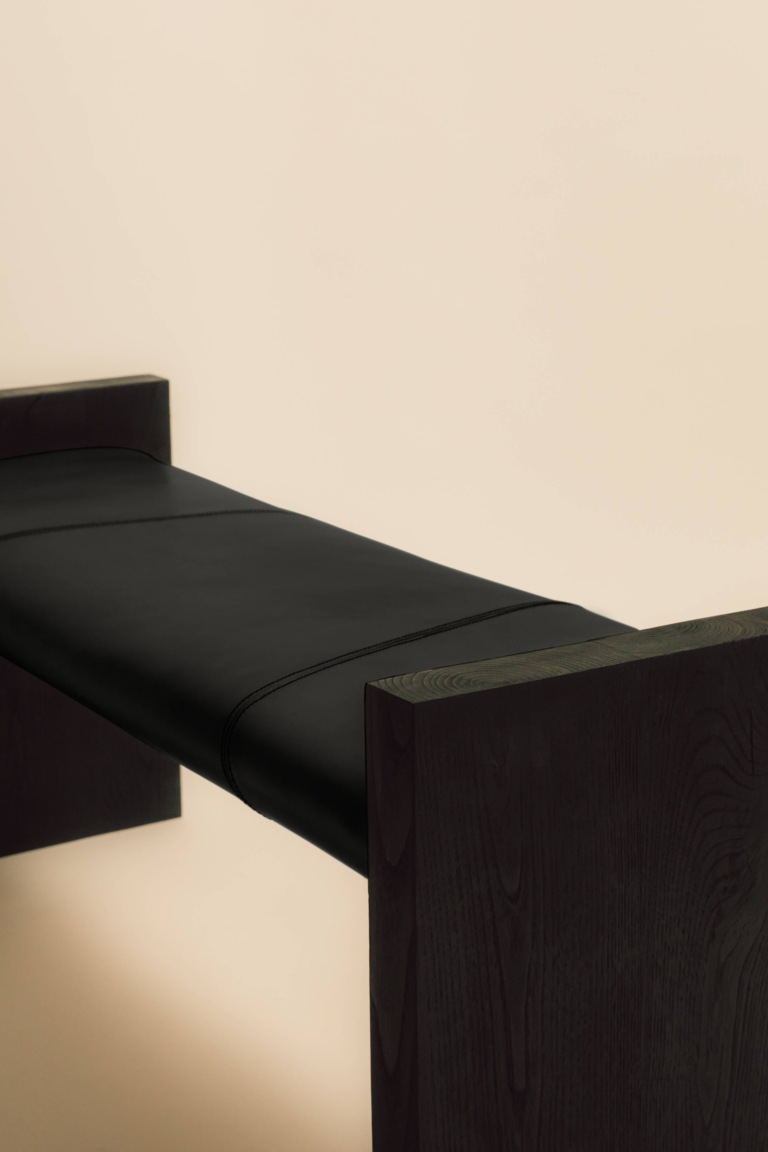 Maërl SEPIA bench, ebonized chestnut and black leather.