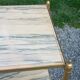 Pair of neoclassical side tables in bronze, brass, marble, and o.