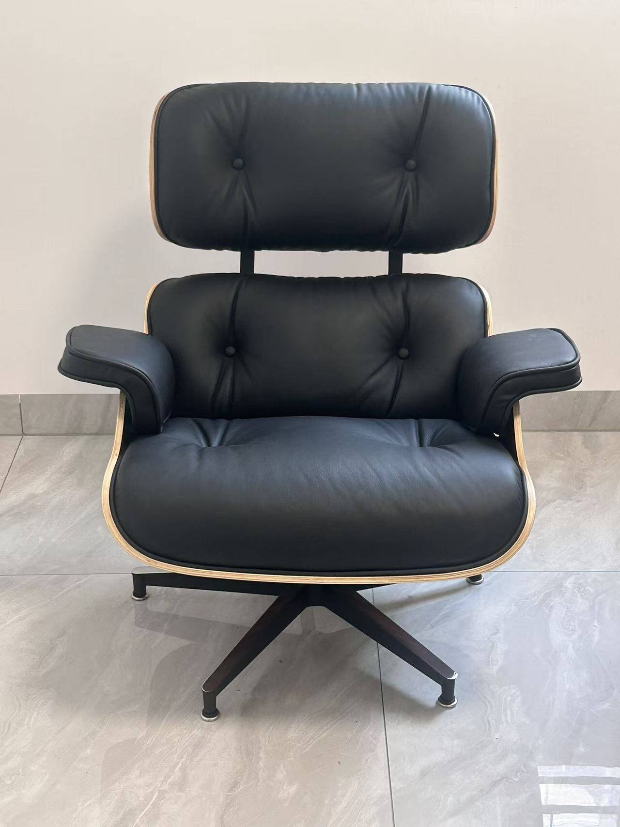 Lounge chair and ottoman by Herman Miller Charles & Ray Eames, rosewood.