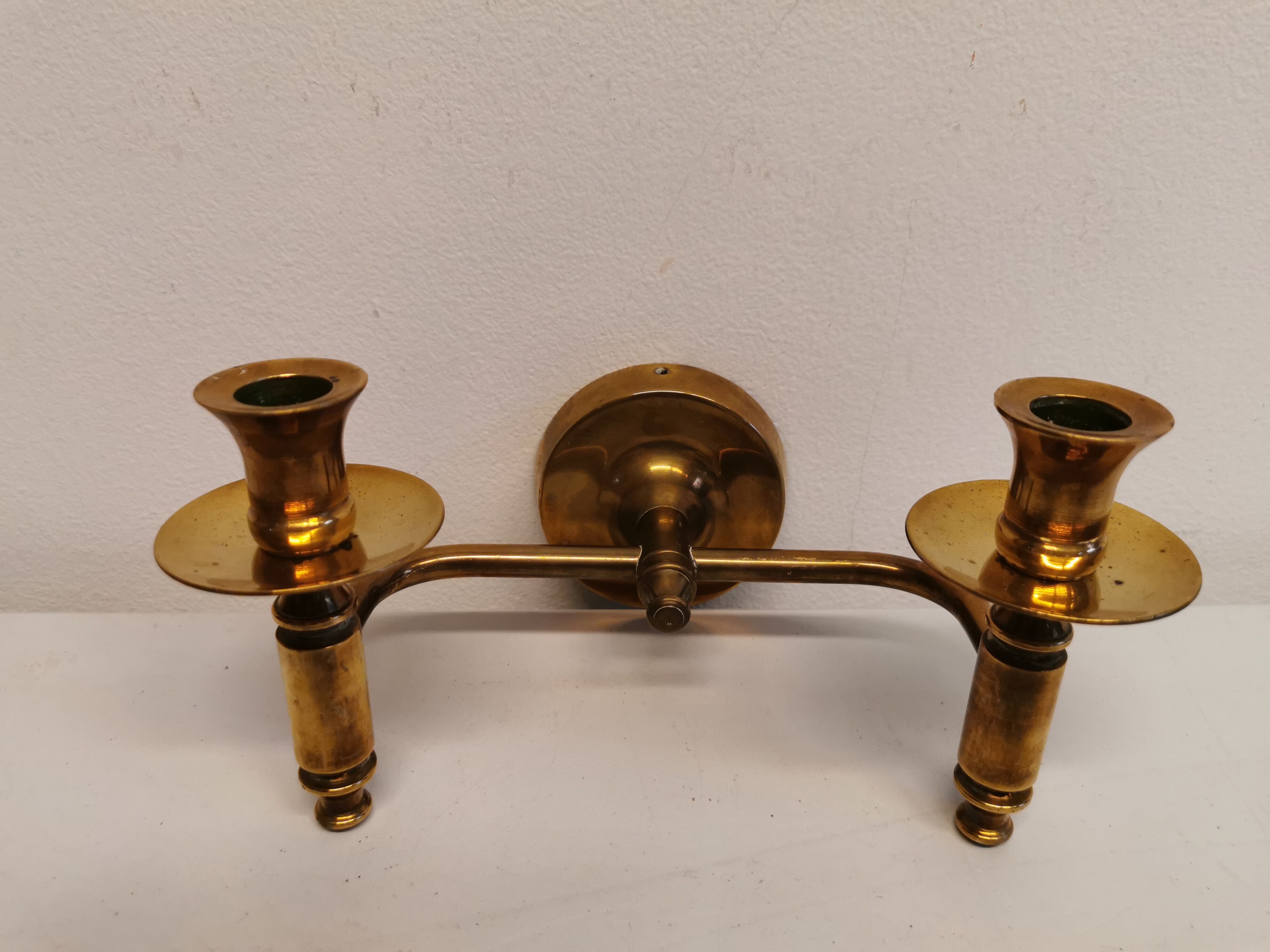 Classic Danish wall hung design candlestick in solid brass