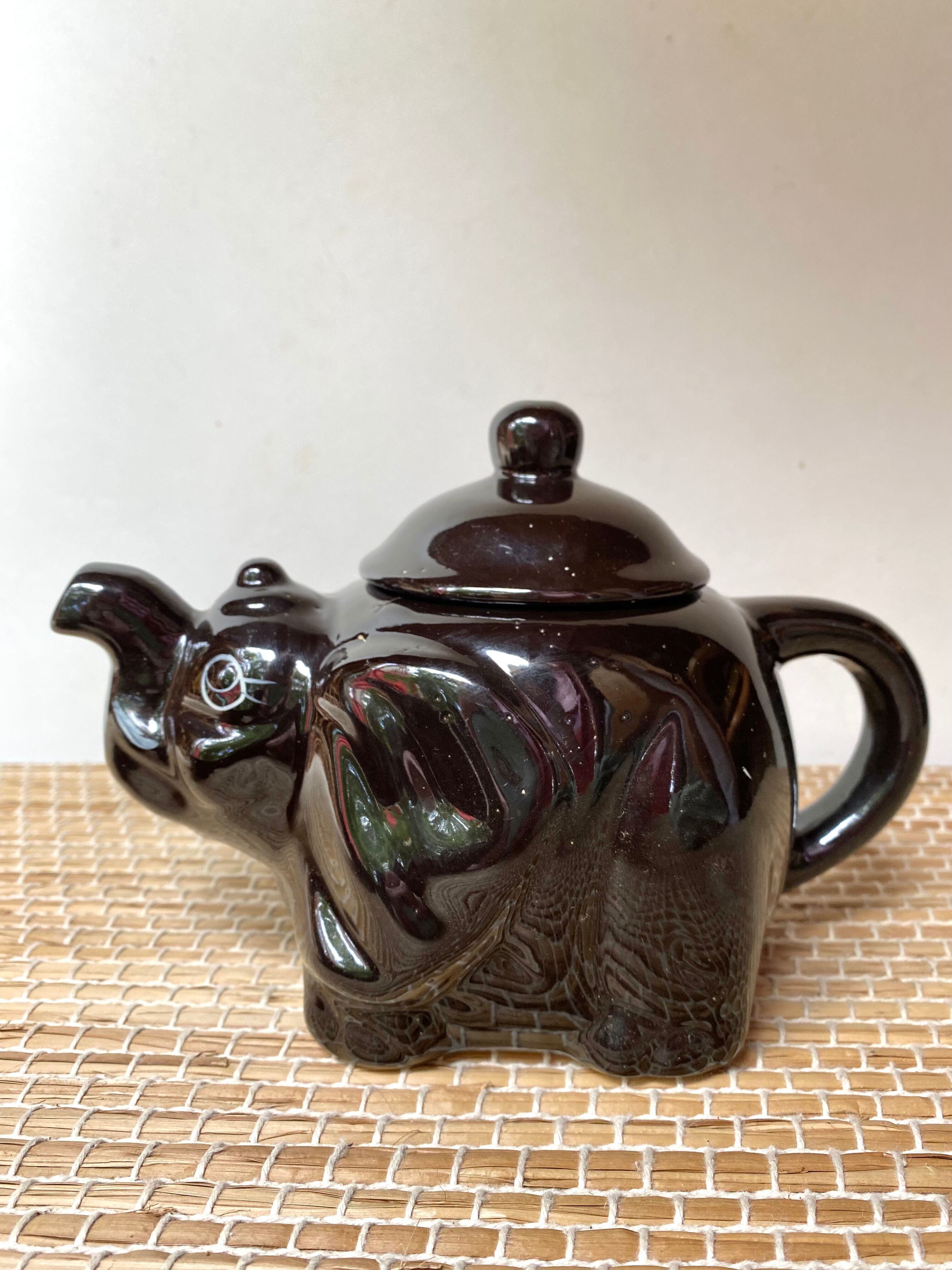 Vintage teapot and vintage elephant cups