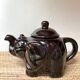 Vintage teapot and vintage elephant cups