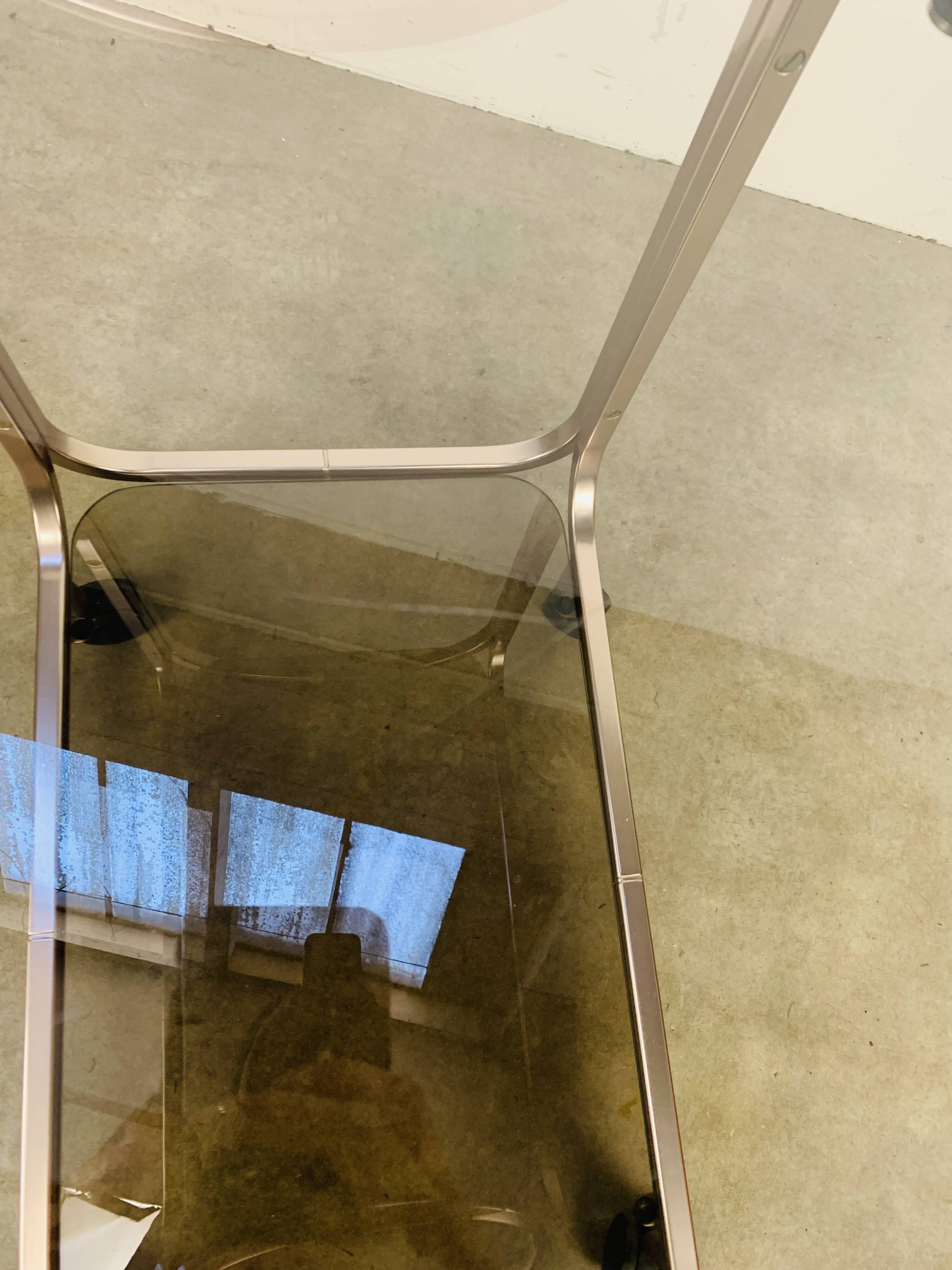 Kaymet dessert trolley in smoked glass and anodised aluminium, 1980s.