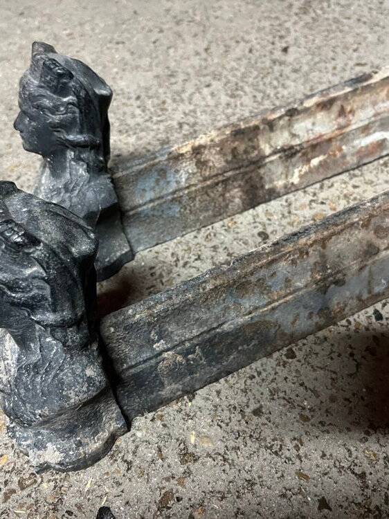 Pair of cast iron fire dogs from the 19th century