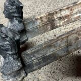 Pair of cast iron fire dogs from the 19th century