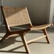 Reclining armchair in natural wood and woven rattan