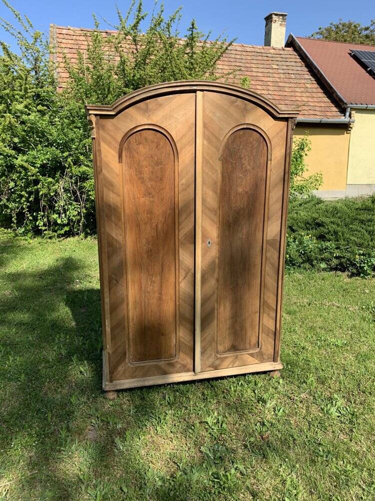 Vintage Hungarian wooden wardrobe in brown with two doors, late 19th century.