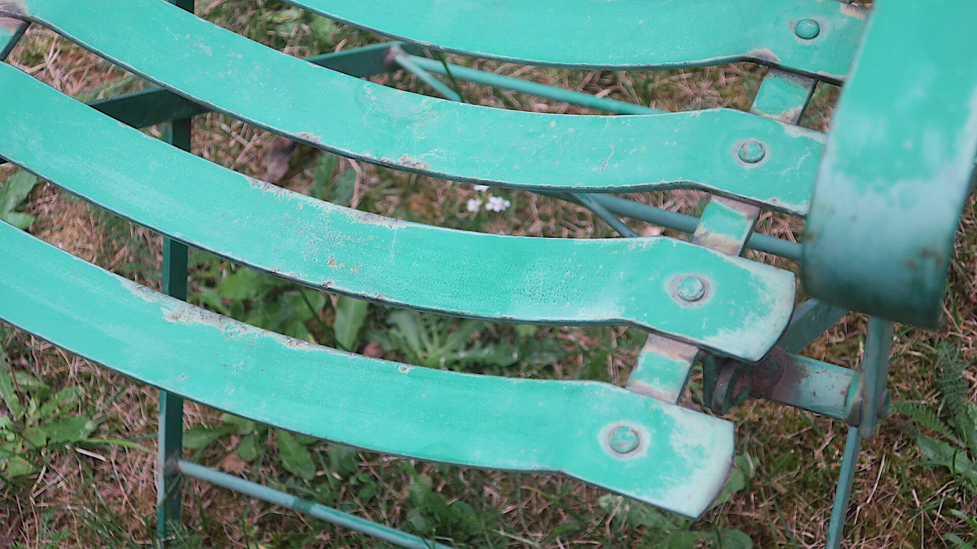 Pair of mid century distressed painted iron garden chairs
