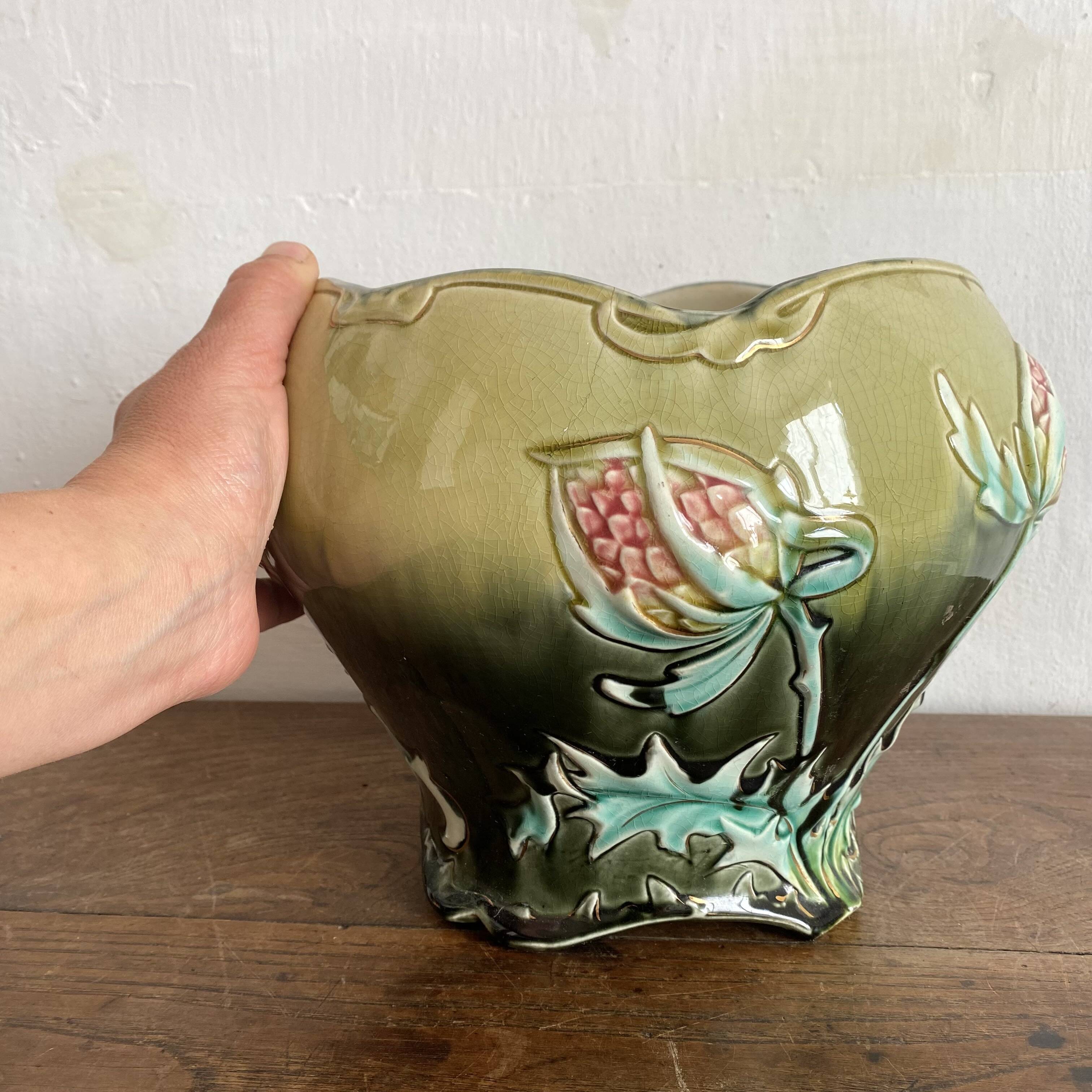 Large earthenware cache-pot in Art Nouveau style, decorated with thistles.