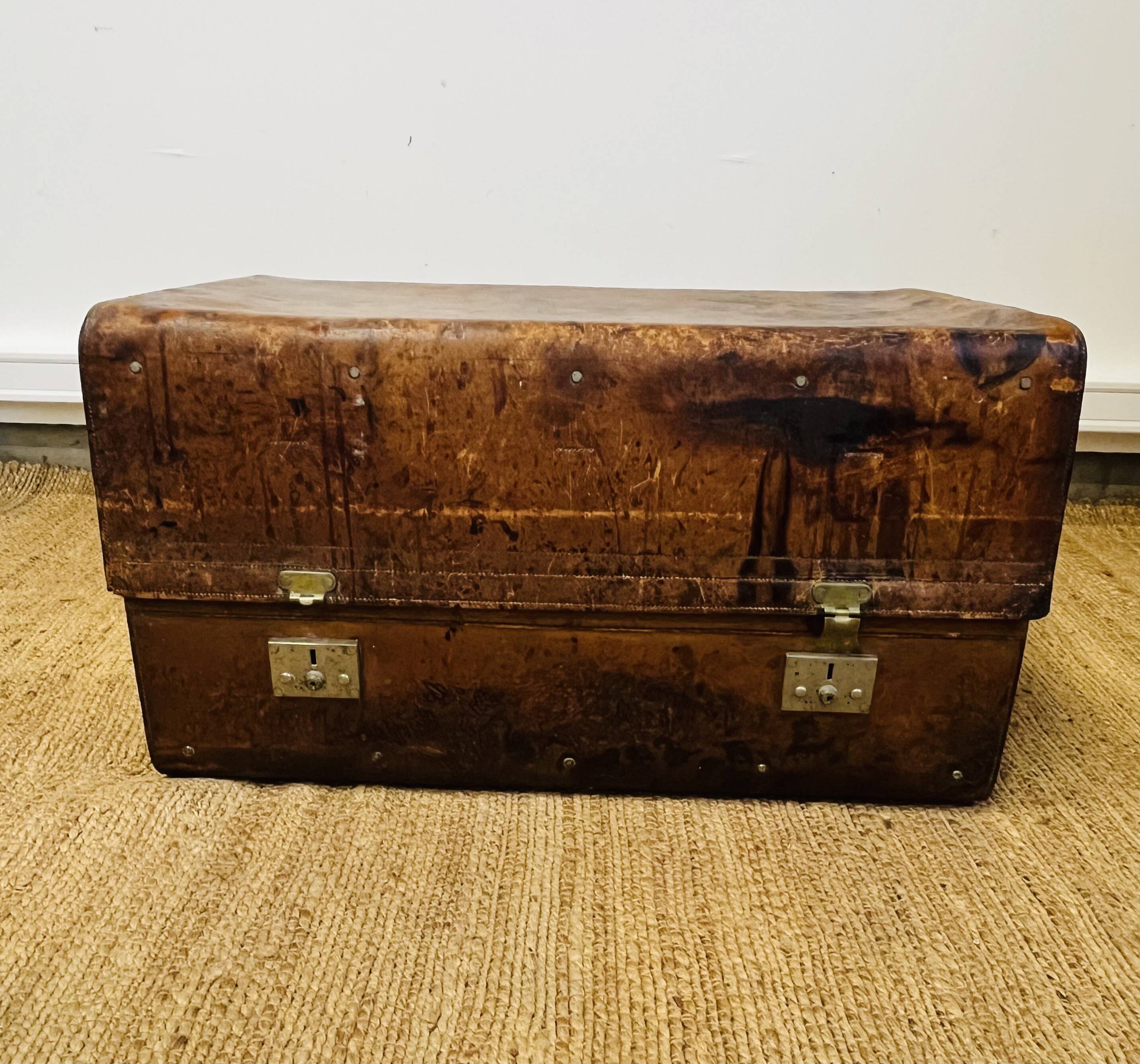 Large Gustave Keller leather trunk with multiple compartments