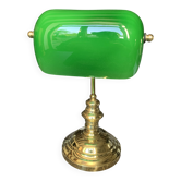 Elegant vintage banker’s lamp with its green glass shade.