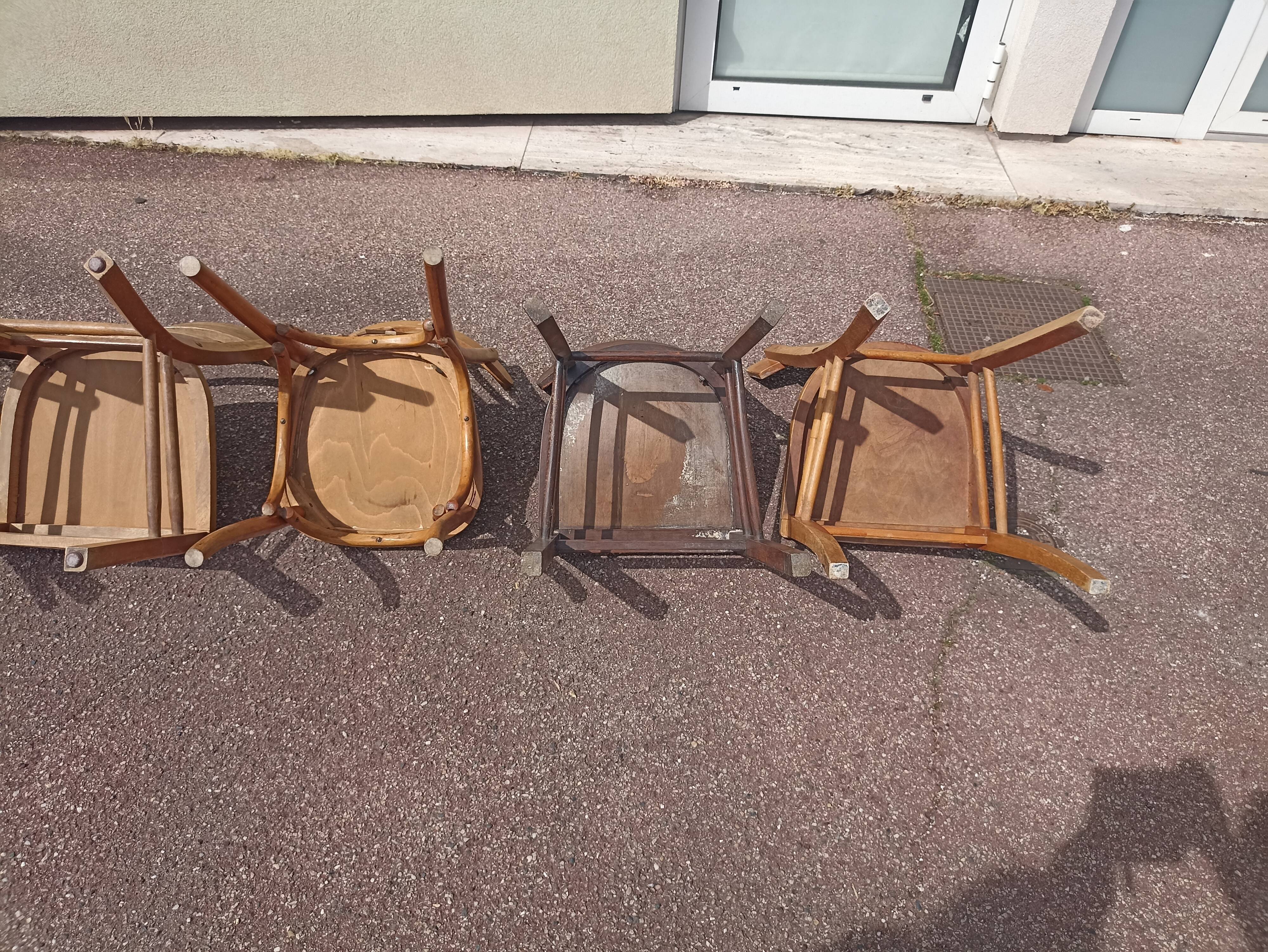 Set of 12 mismatched wooden bistro chairs