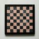Small chessboard in coral marble and black marble - Italy - Second half of the twentieth century