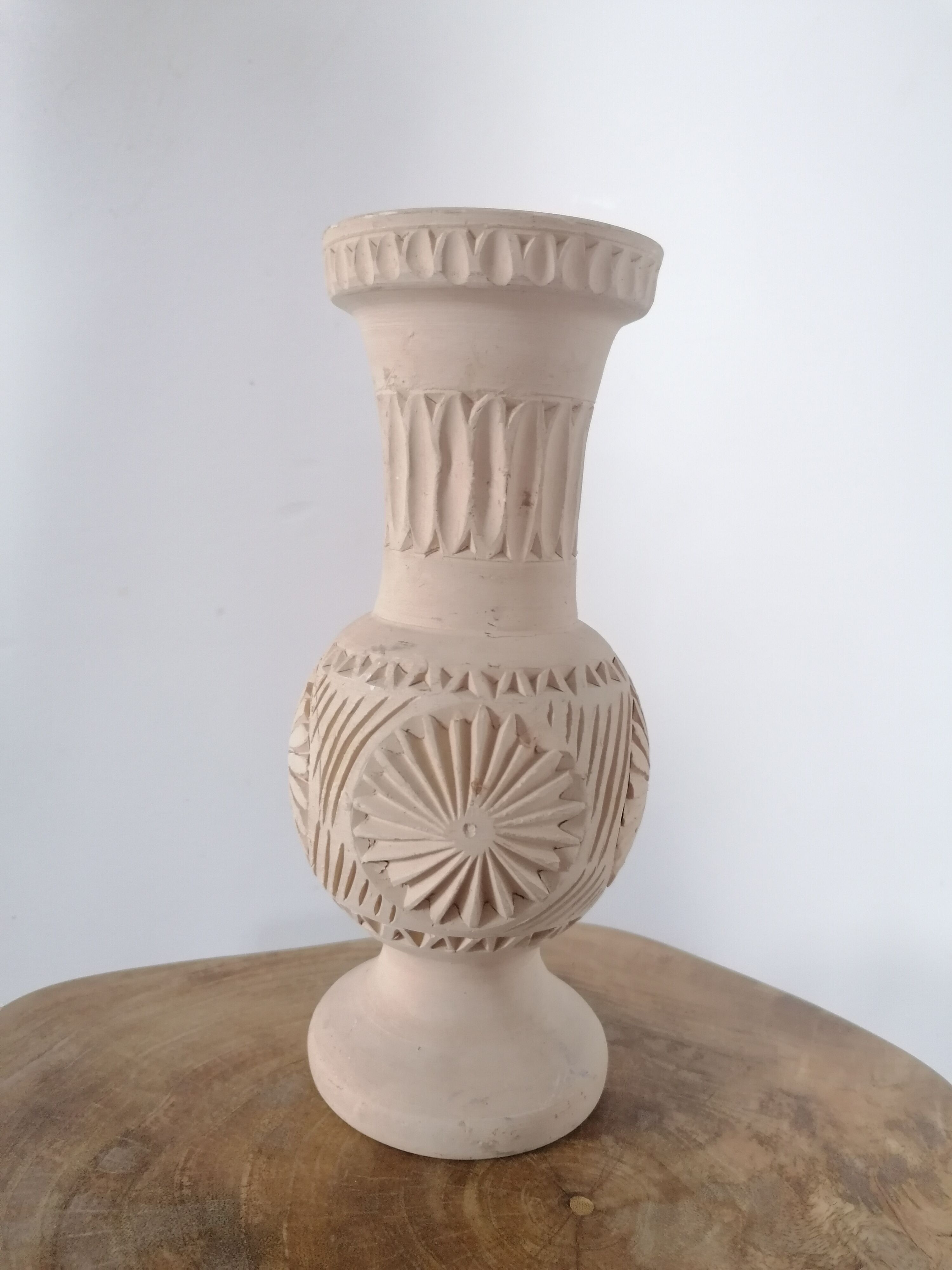 Clear natural terracotta vase decorated ethnic motifs
