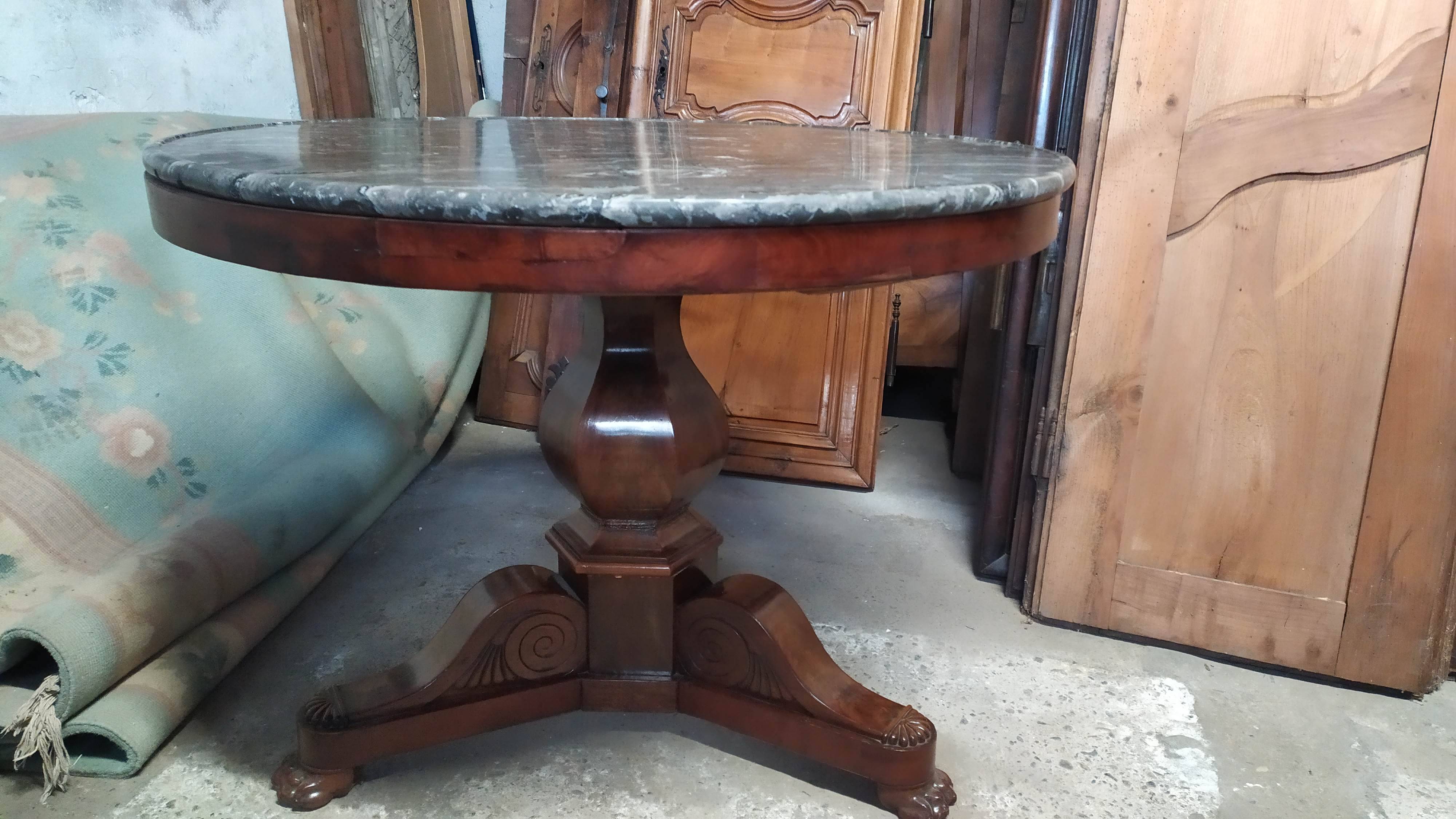 Pedestal table with gray depression marble