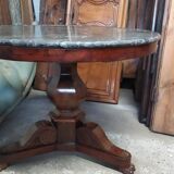 Pedestal table with gray depression marble