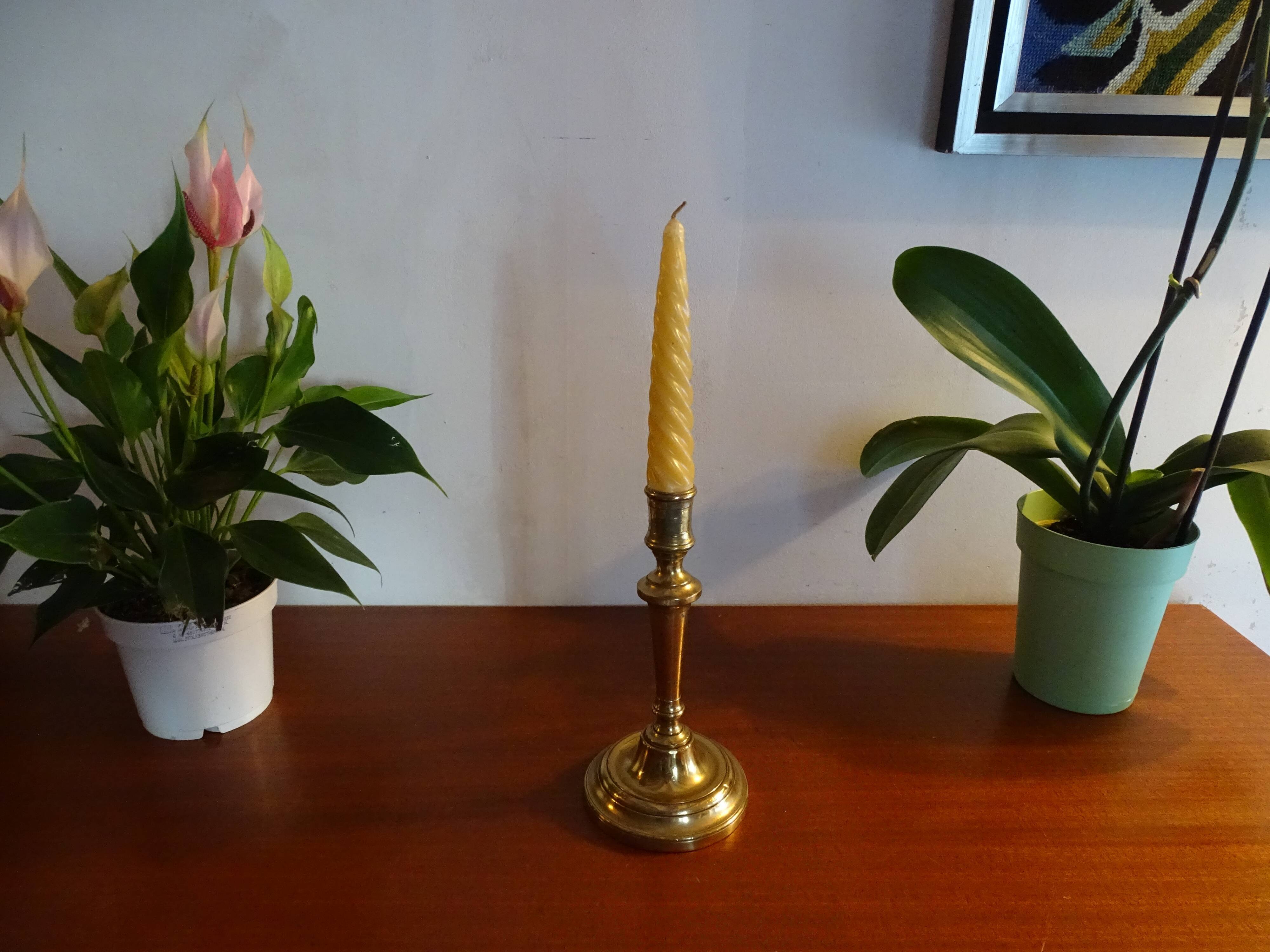 Old brass candle holder and its candle 21.5 cm