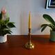 Old brass candle holder and its candle 21.5 cm