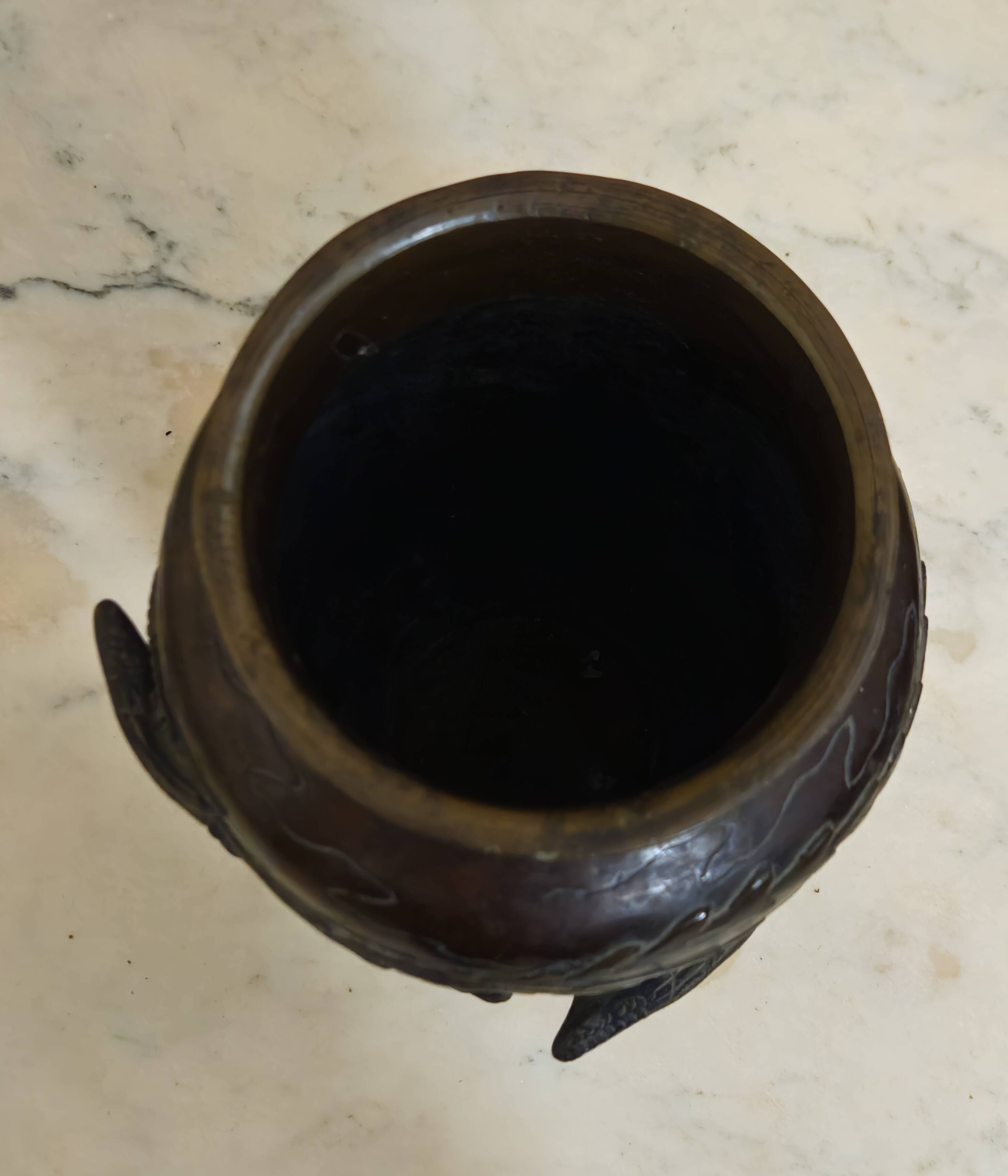 Patinated bronze vase with relief decoration