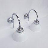 Swan neck and white glass wall lights