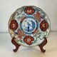 Imari porcelain plate from Japan, 19th century, hand-painted decoration.
