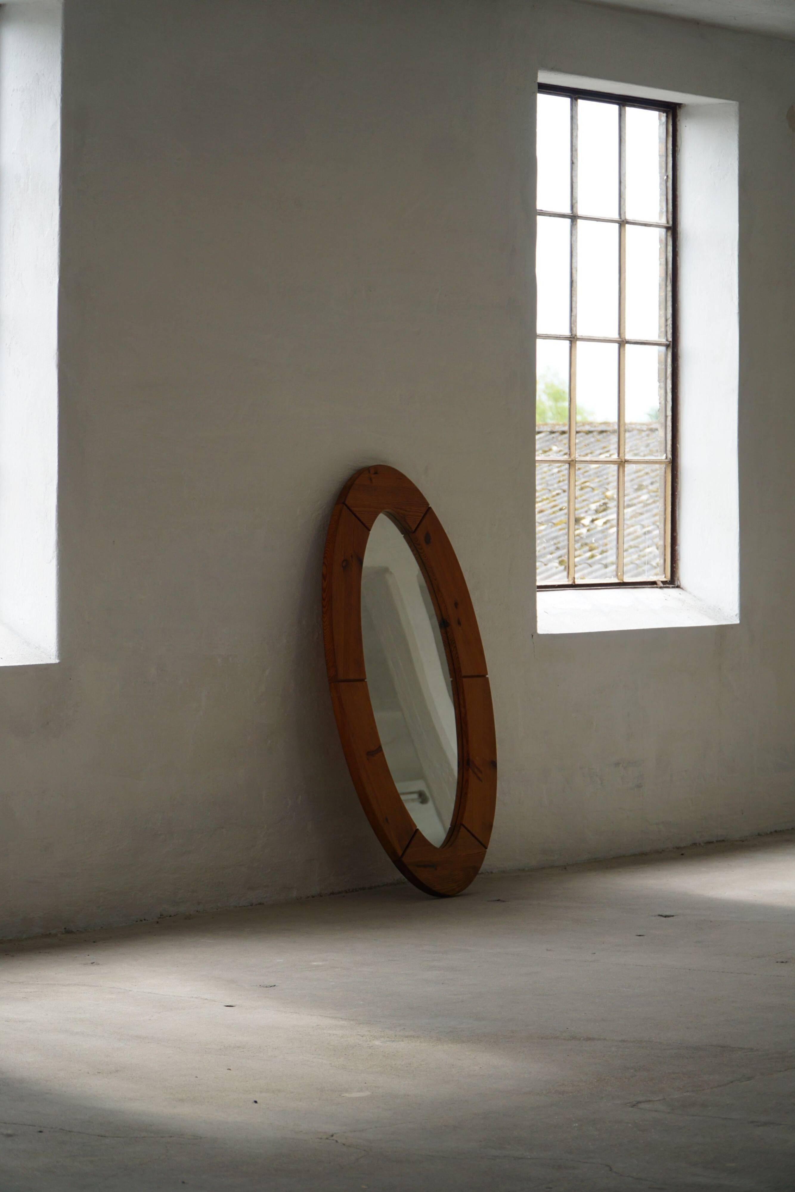 Large oval wall mirror in solid pine by Glasmäster Markaryd, Sweden, 1960s.