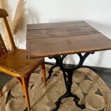 Bistro table with iron legs and raw wood top