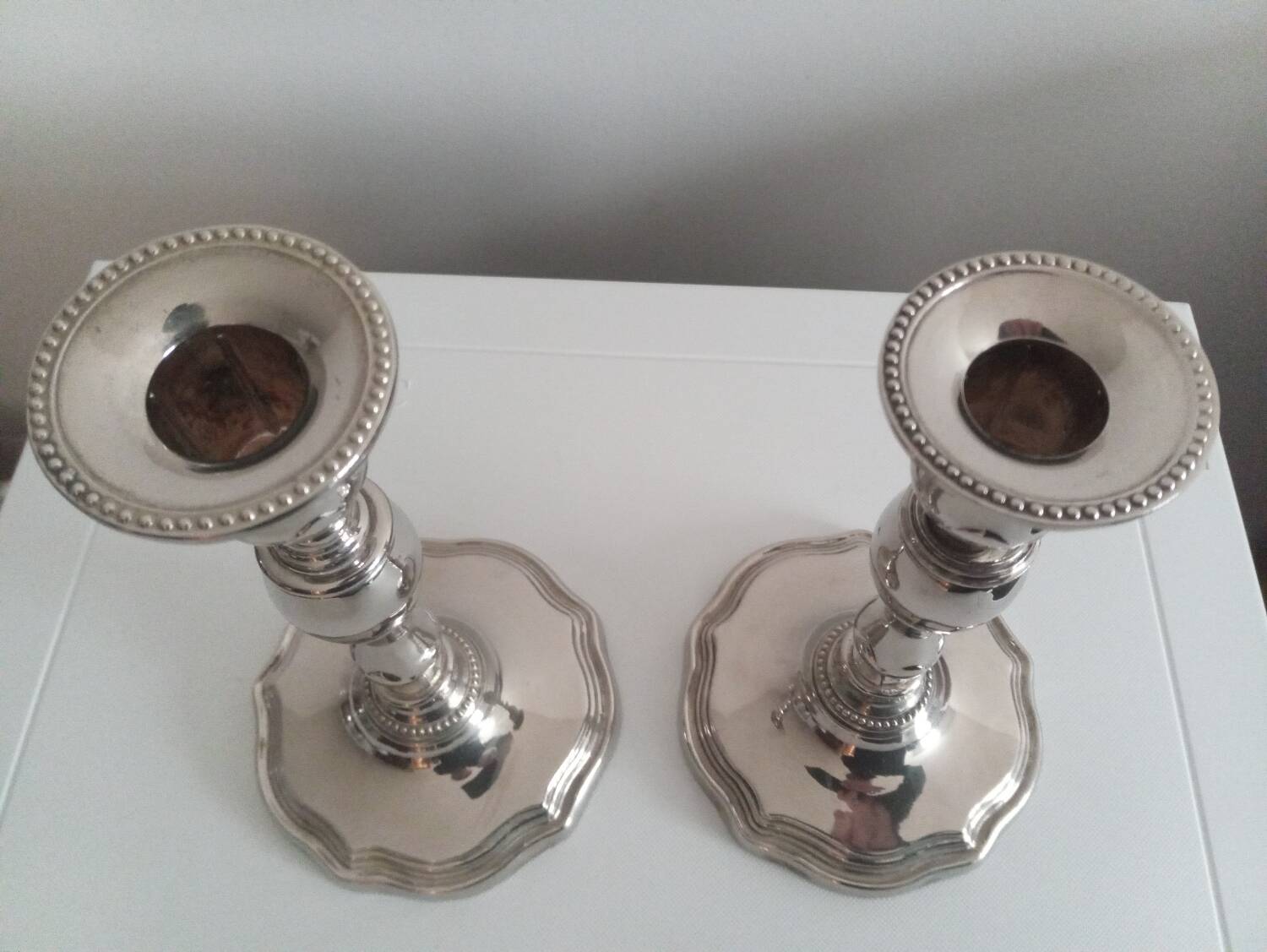 Pair of silver-plated metal candlesticks