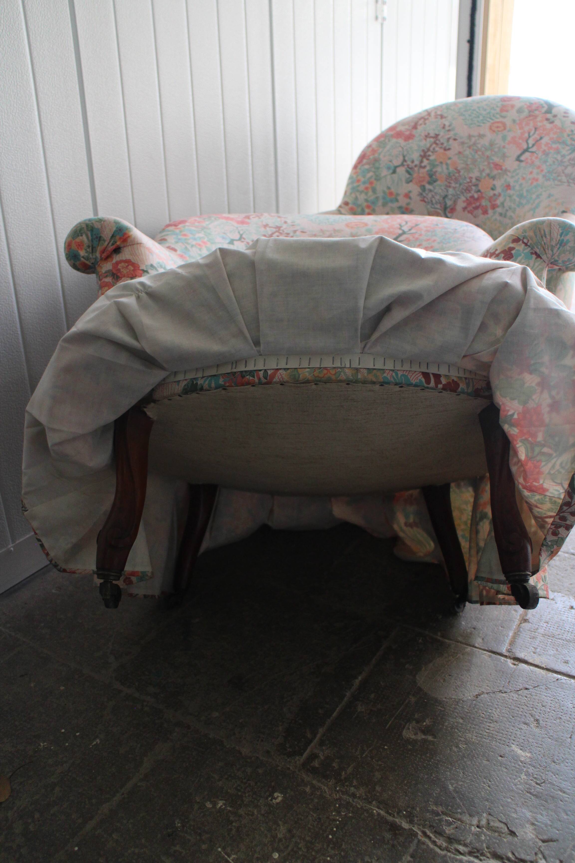 pair of toad armchairs in floral fabric.