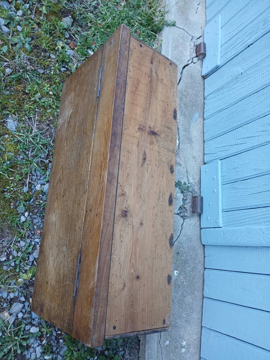 Small old wooden chest with hinged lid