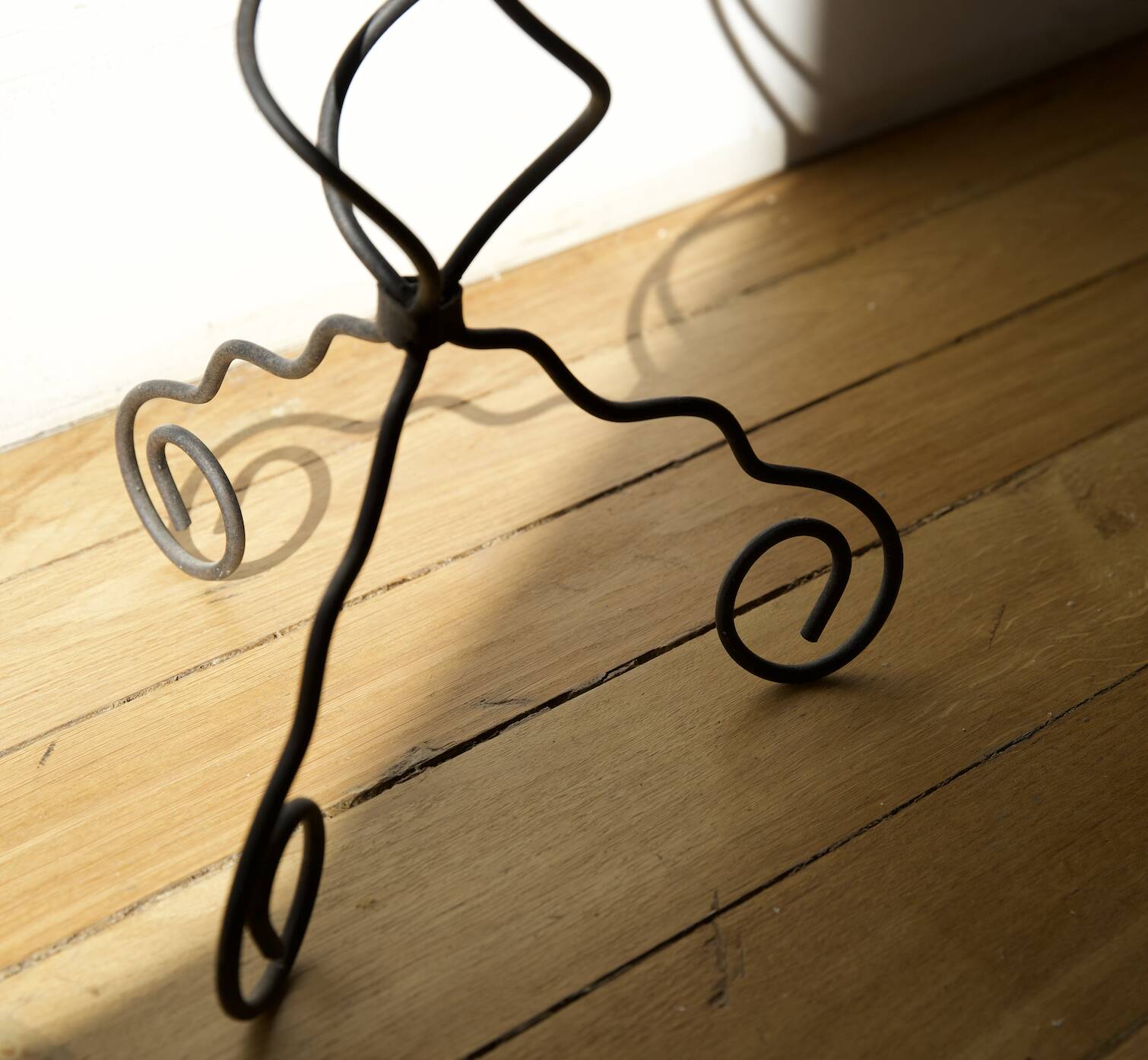 candlestick on wrought iron feet