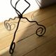 candlestick on wrought iron feet
