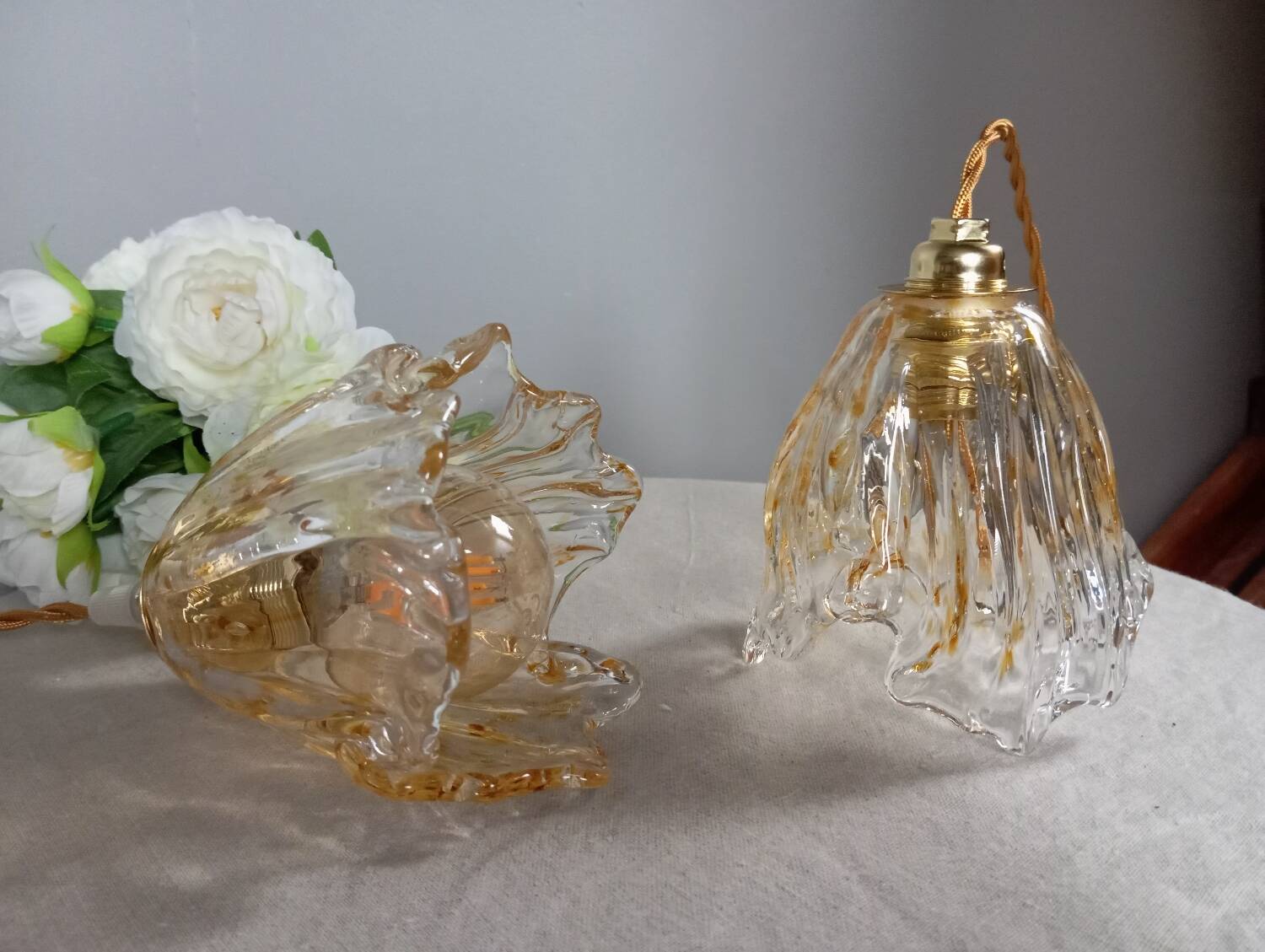 Pair of draped blown glass hanging lamps, ocher twisted wire