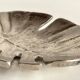 Leaf-shaped metal pocket emptier