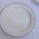 Set of 4 white and blue dinner plates.