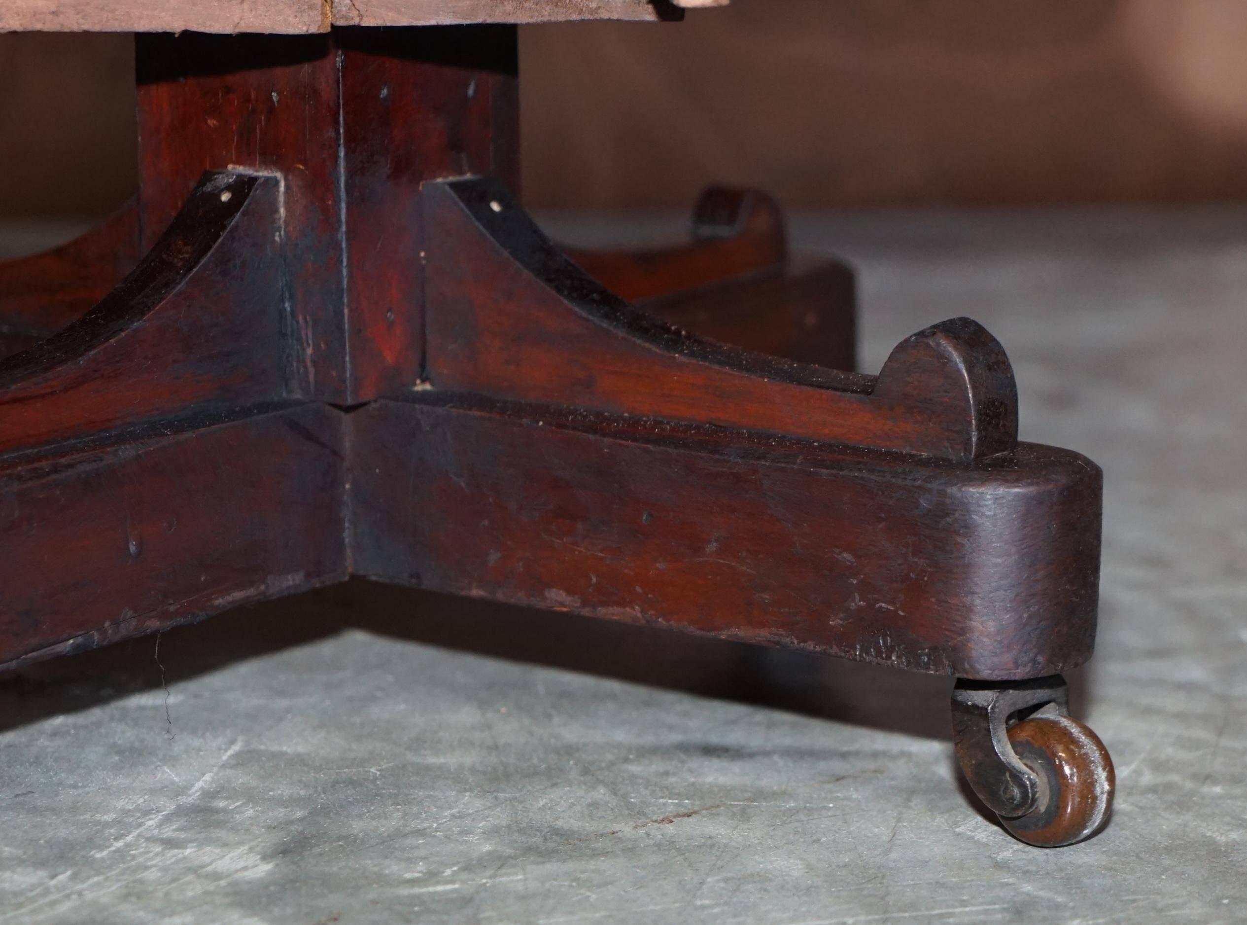 Edwardian revolving bookcase in hardwood with Sheraton inlay.