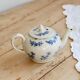 Antique teapot Saint-Uze steel clay with cobalt blue floral decoration.