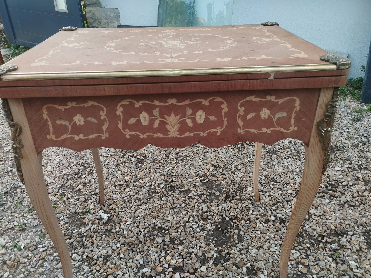 Antique game table in Louis XVI style with marquetry.