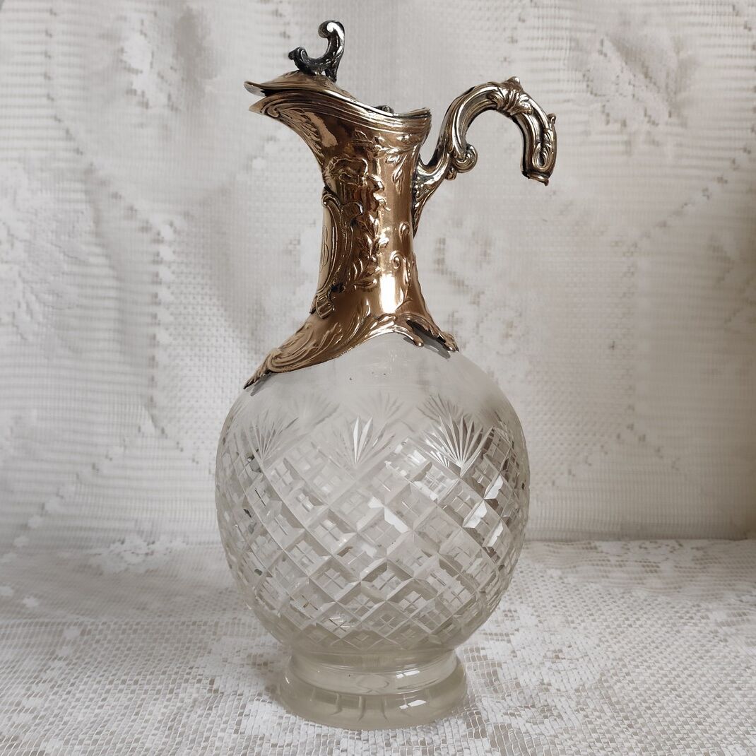 Cut crystal ewer and brass