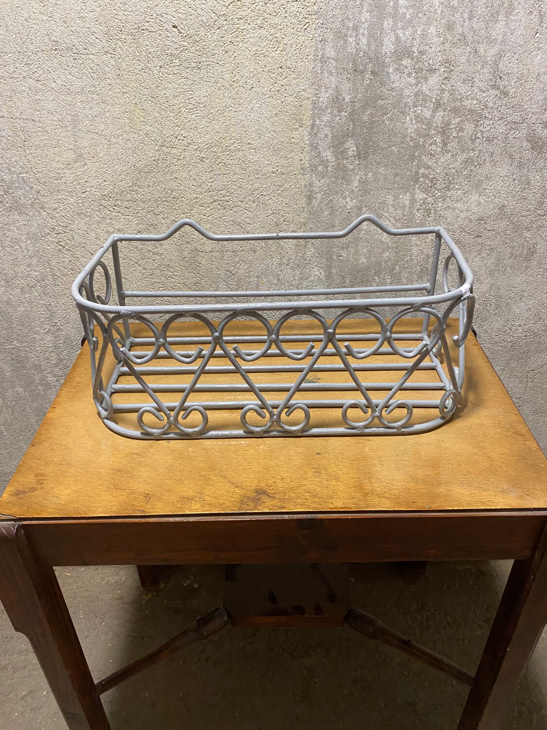 Gray wrought iron shelf