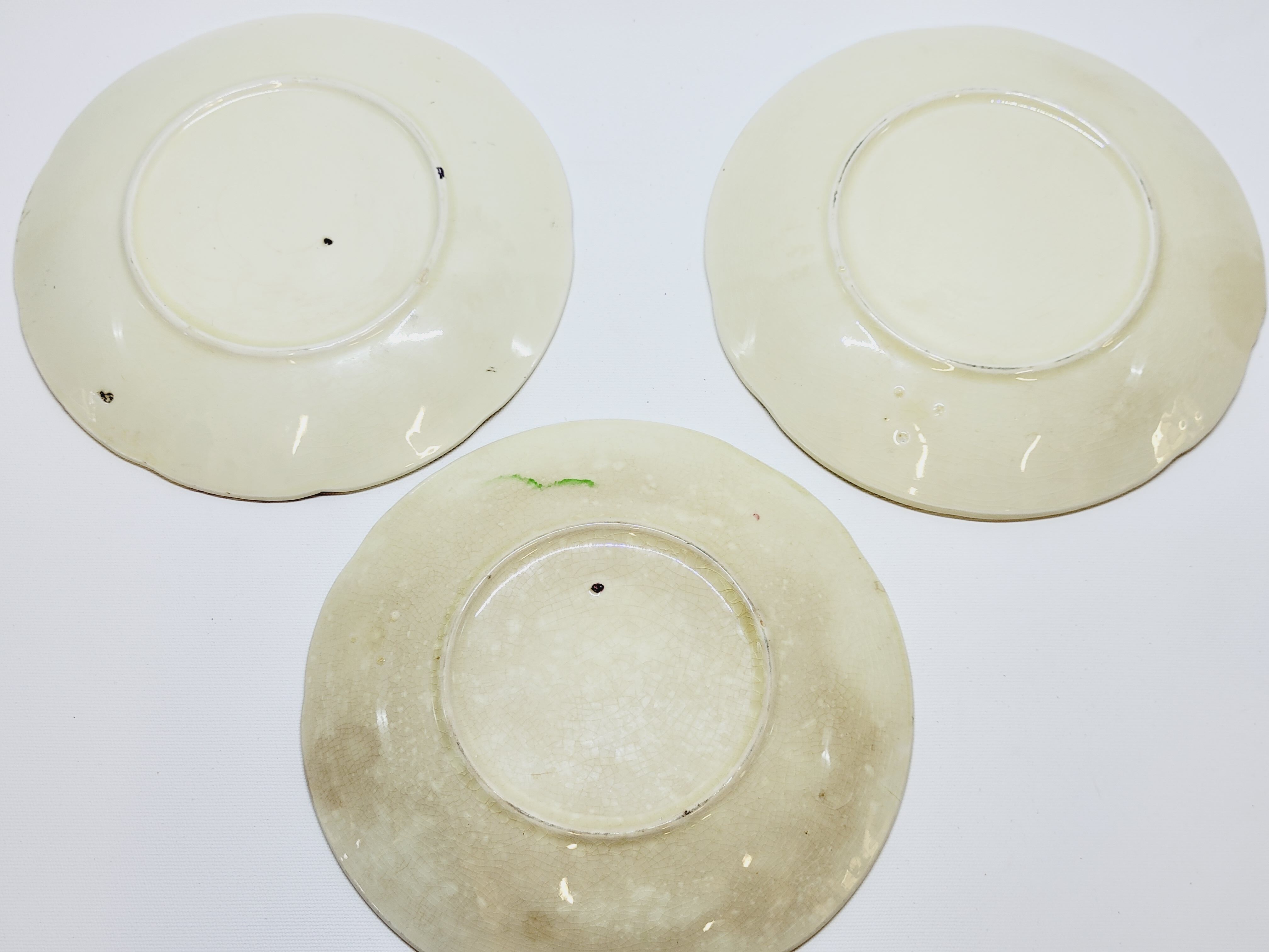 3 old plates in slip decoration strawberries and grapes