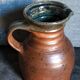 Pitcher traditional pottery Folk art in old enamelled sandstone