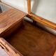 Counter, glass-fronted wooden workbench in dark wood, 8 drawers.