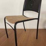 Set of 8 chairs in black lacquered metal and straw seats